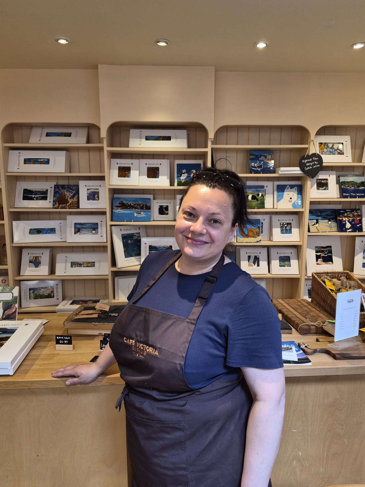 Expert barista crafting a specialty pour-over coffee at Paulo Coffee Inverness